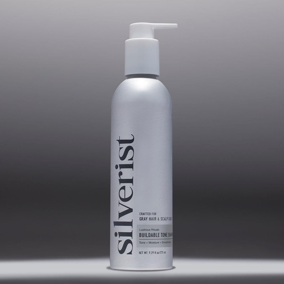 A bottle of Lustrous Rituals Buildable Tone Shampoo by Silverist, designed for natural gray, silver, and white hair.