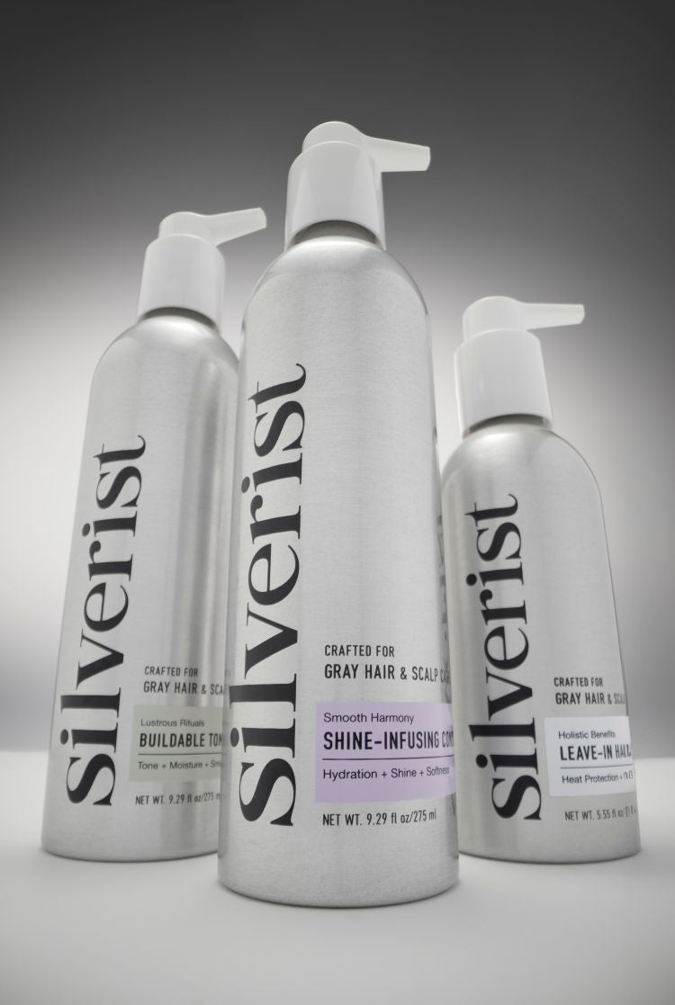 Three bottles of Silverist hair care products on a gray background
