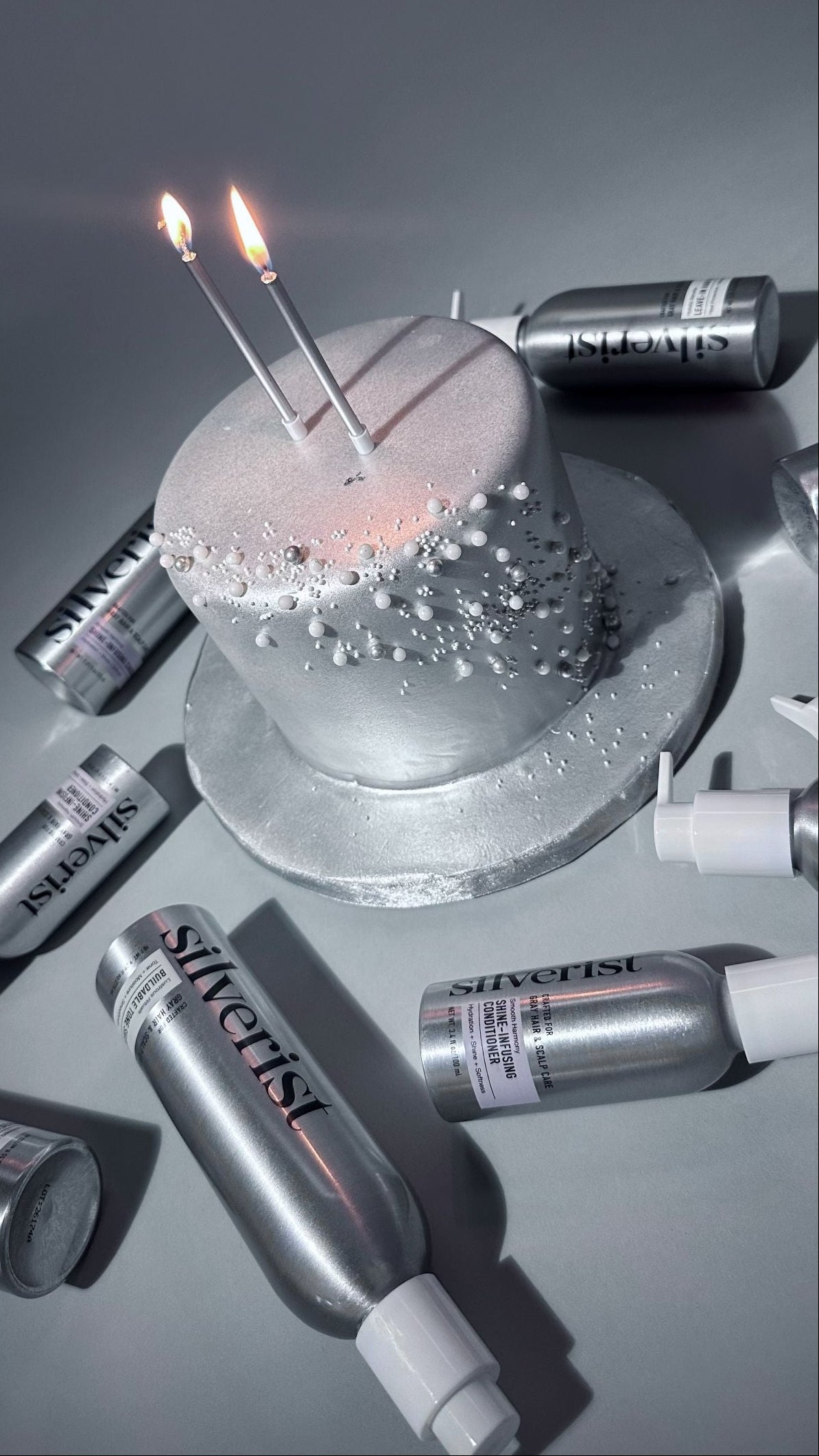 Silver fondant birthday cake with two candles and Silverist product