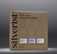 A travel size kit box labeled 'Silverist Natural Silver Hair Essentials' with images of three bottles: shampoo, conditioner, and hair serum.