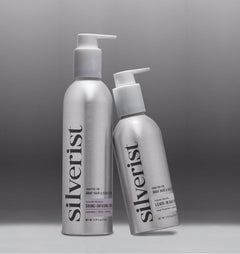 Two silver bottles labeled 'silverist' on a gray background