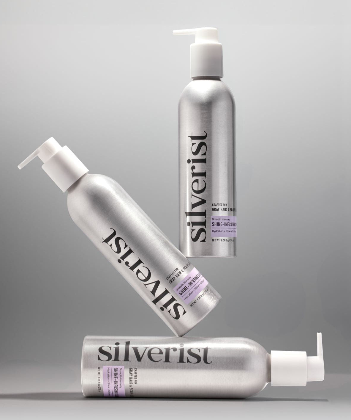 Three bottles of Silverist conditioner products on a gray background